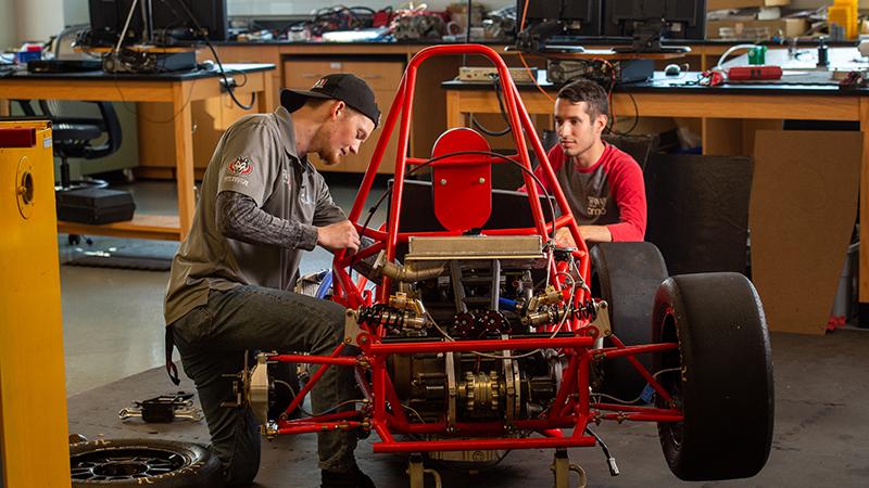 Students working on race car